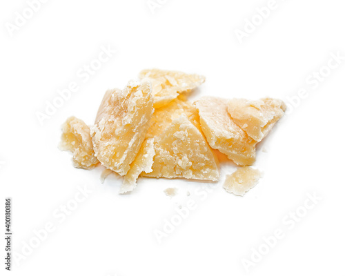Parmesan slices isolated on white background. Italian traditional cheese.