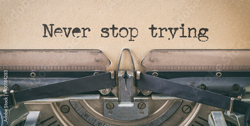 Text written with a vintage typewriter - Never stop trying