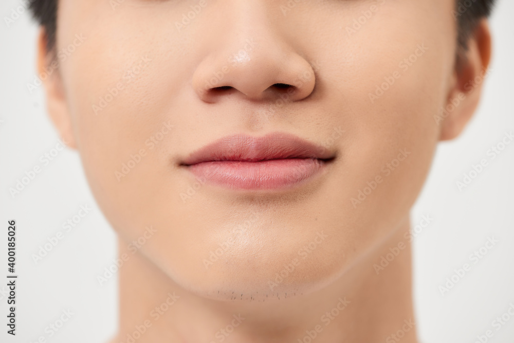 Close-up shot of a part of man's face. Isolated on white background Close-up shot of a part of man's face. Isolated on white background