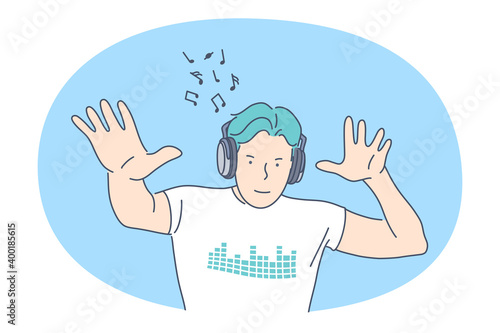 Listening to Music, recreation concept. Smiling man in headphones listening to favourite music and dancing with rhythm. Music lover, melody, song, hobby