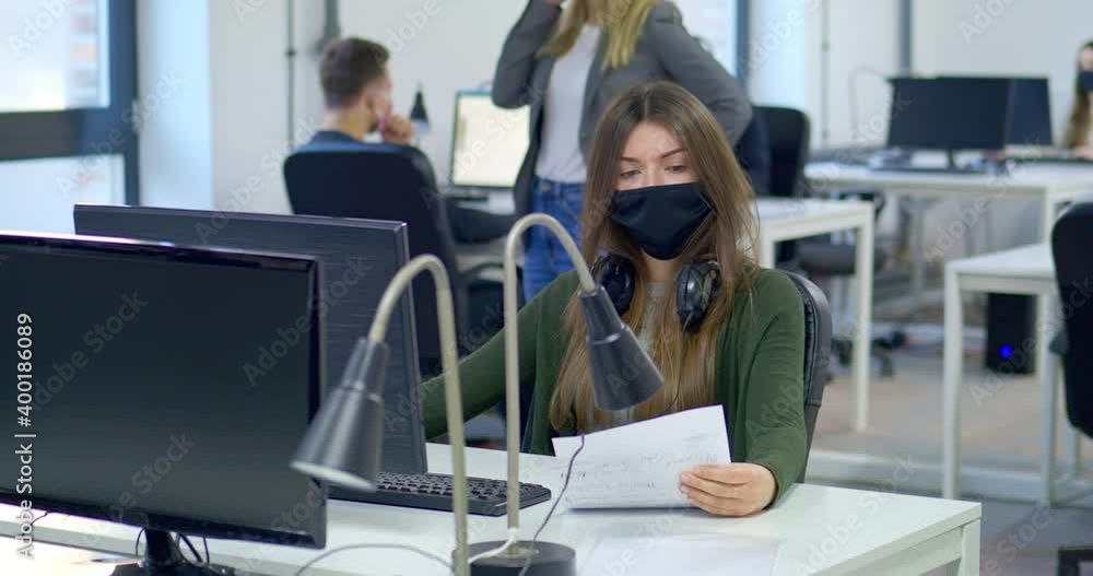 MS DS Office workers wearing protective face masks MS DS Office workers wearing protective face masks
