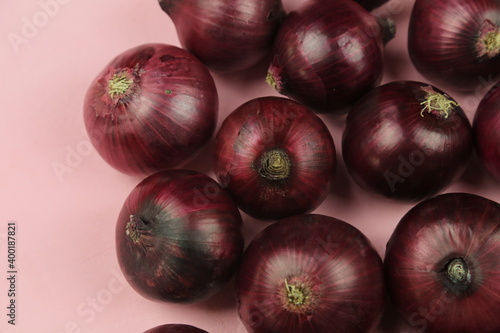 sweet red onions on background