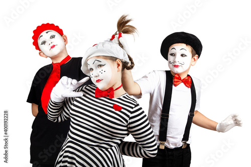 Photos boys and a teenage girl in the image of a mime with makeup on her face, isolate