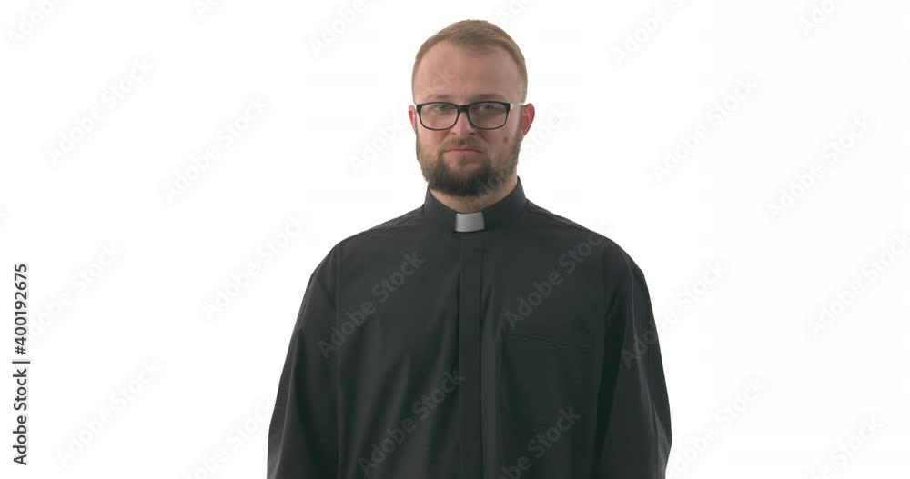 Portrait of confident Caucasian priest pointing oneself with fingers and gladly nodding. Isolated on white background. Portrait of confident Caucasian priest pointing oneself with fingers and gladly nodding. Isolated on white background.