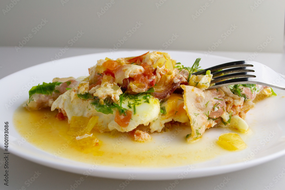 scrambled eggs with bacon and vegetables on a plate scrambled eggs with bacon and vegetables on a plate