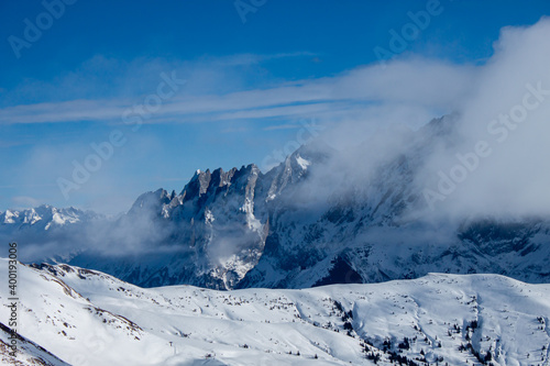 Great winter landscape. Mountains, clouds, fog and snow.