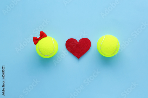 Smiling tennis balls girl with red bow and boy and hearts. Valentine’s Day tennis flatly celebration card, poster. Love and tennis concept .flatly