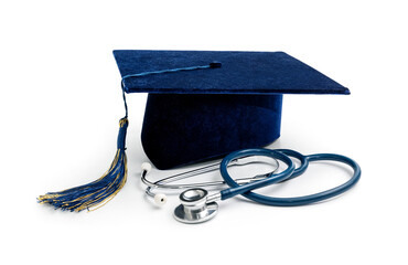 medical education - college graduation cap and stethoscope isolated on white background