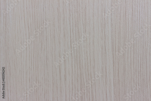 The surface of a light beige wood board.