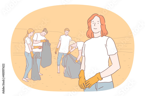 Saving ecosystem, ecology, environment cleaning volunteer concept. Group of young activists in gloves picking trash into big bag on beach. Collecting rubbish, cleaning, ecological support 