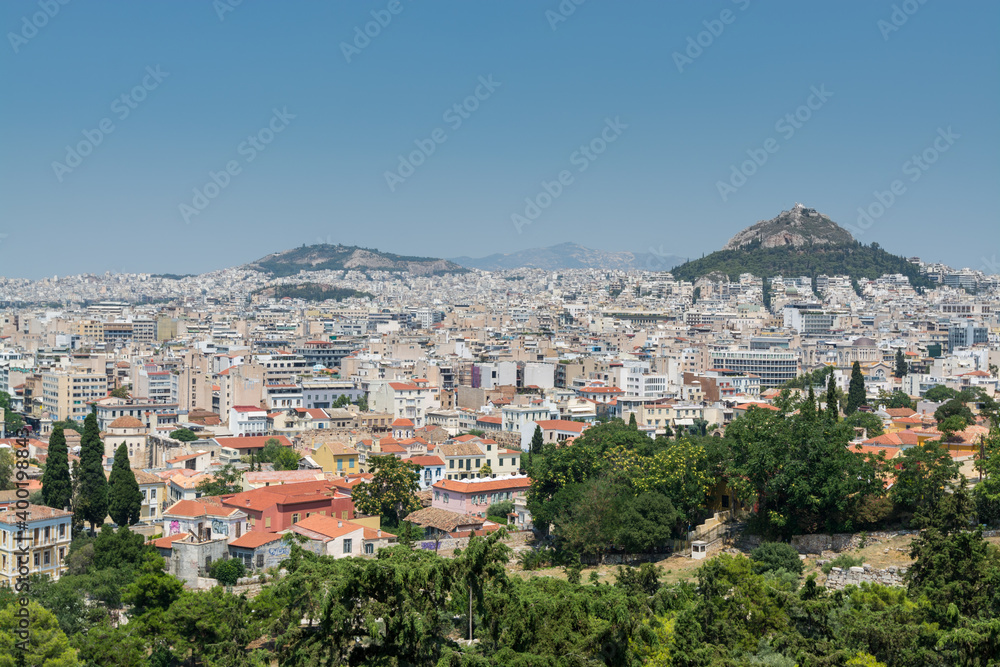 Aerial view of cityscape near Acropolis with crowded buildings of Athens in a sunny day in Greece Areopagus Hill