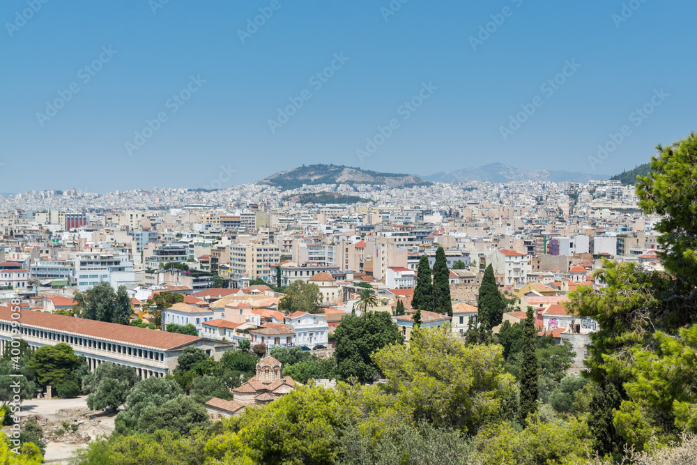 Aerial view of cityscape near Acropolis with crowded buildings of Athens  with Stoa of Attalos in a sunny day, view from Greece Areopagus Hill