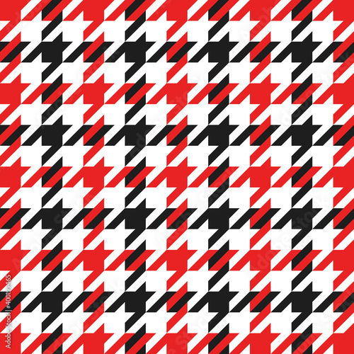 Goose foot. Christmas Pattern of crow is feet in red and black cage. Glen plaid. Houndstooth tartan tweed. Dogs tooth. Scottish checkered background. Seamless fabric texture. Vector illustration
