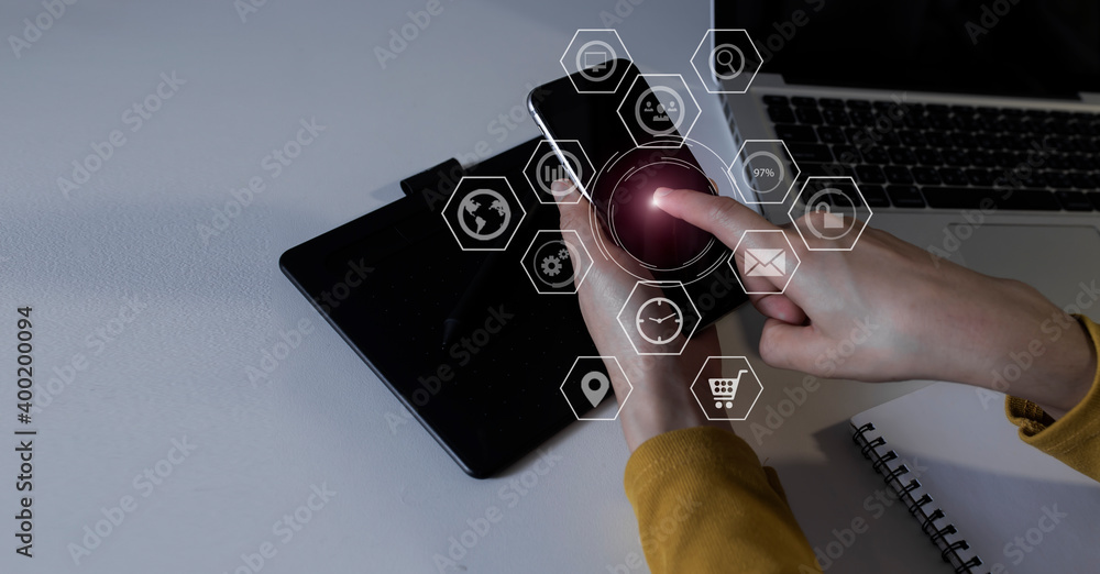 Businesswoman hands using smartphone with network online interface icons. Business digital technology network marketing concept. 
