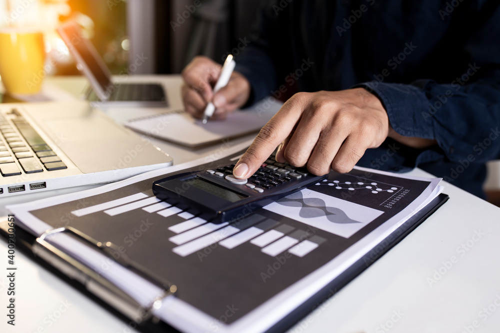 business hands working on digital smartphone and laptop computer at table office. business technology and financial advisor and accounting concept. business hands working on digital smartphone and laptop computer at table office. business technology and financial advisor and accounting concept.