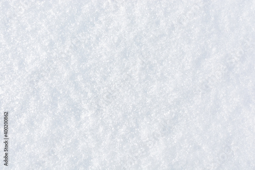 Fresh clean snow background. Frosty winter texture with snowflakes for design.