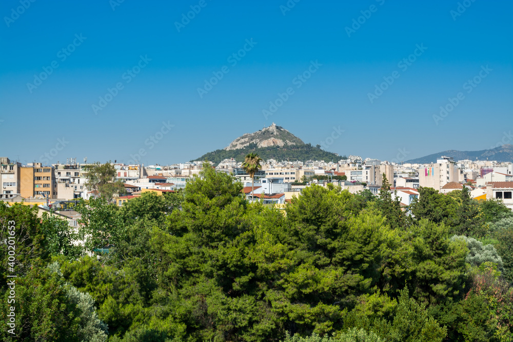 Aerial view of cityscape near Acropolis with crowded buildings of Athens in a sunny day in Greece, view from Areopagus Hill