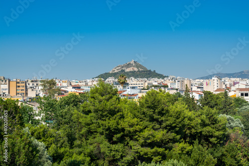 Aerial view of cityscape near Acropolis with crowded buildings of Athens in a sunny day in Greece, view from Areopagus Hill