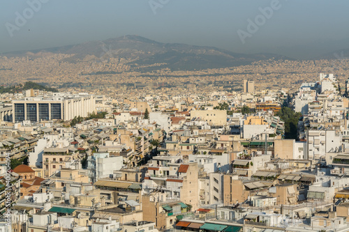 Aerial view of cityscape with high skyline and rooftops of Athens in a sunny day, Greece © zz3701