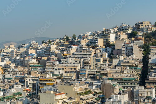 Aerial view of cityscape with crowded buildings of Athens in a sunny day in Greece