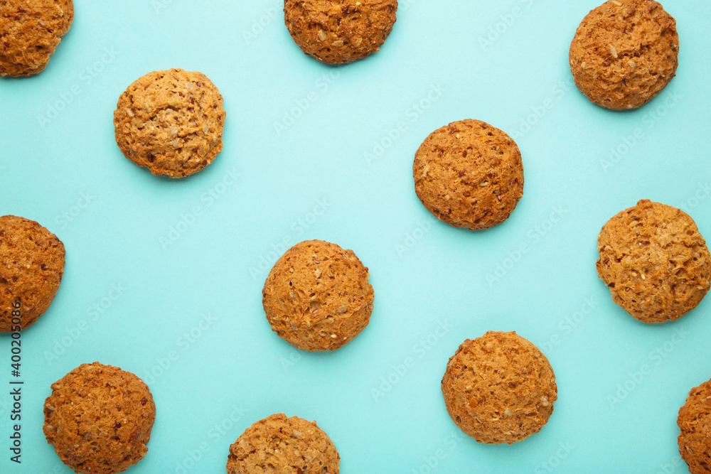 Many oats biscuits on a blue background Many oats biscuits on a blue background