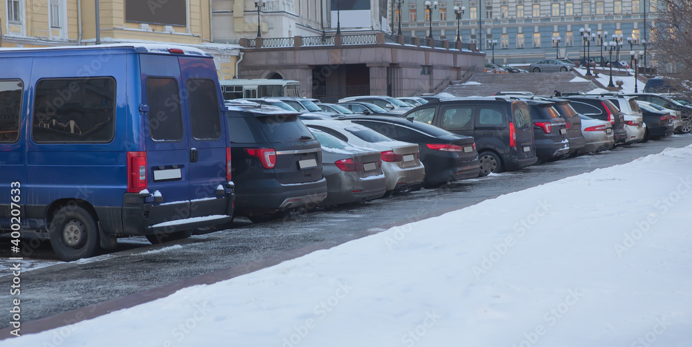 Fototapeta premium Cars in winter in a parking lot