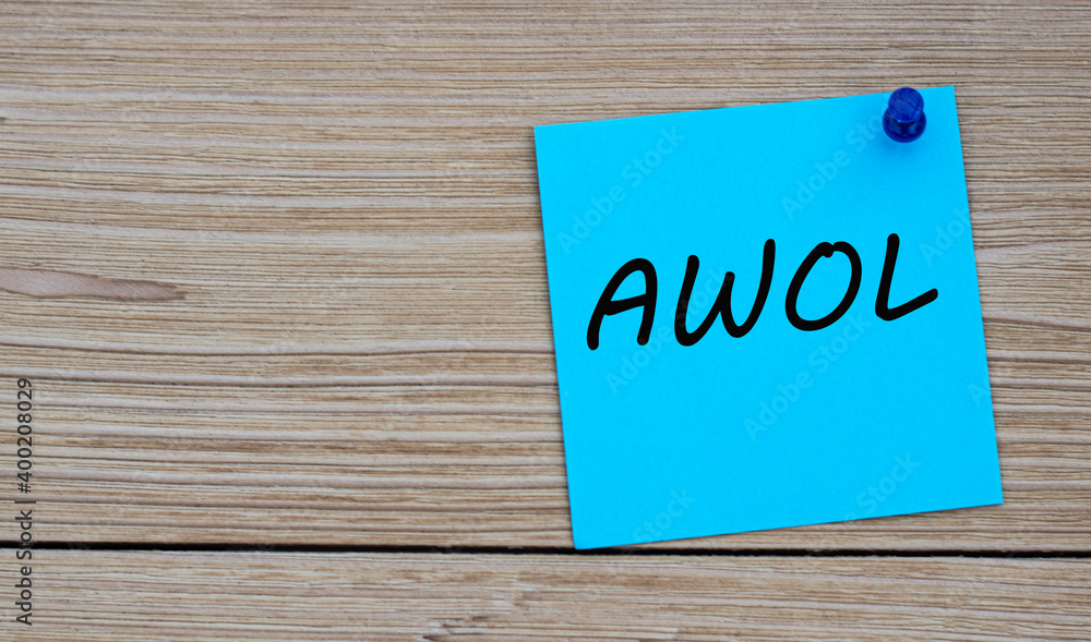 AWOL - acronym written on a blue sheet pinned to a wooden board AWOL - acronym written on a blue sheet pinned to a wooden board