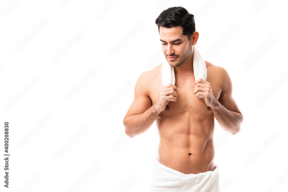 Fototapeta premium Attractive latin man after bath in towel