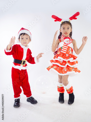 Merry Christmas girl Wearing Santa claus suit Dancing baby shark on white background
