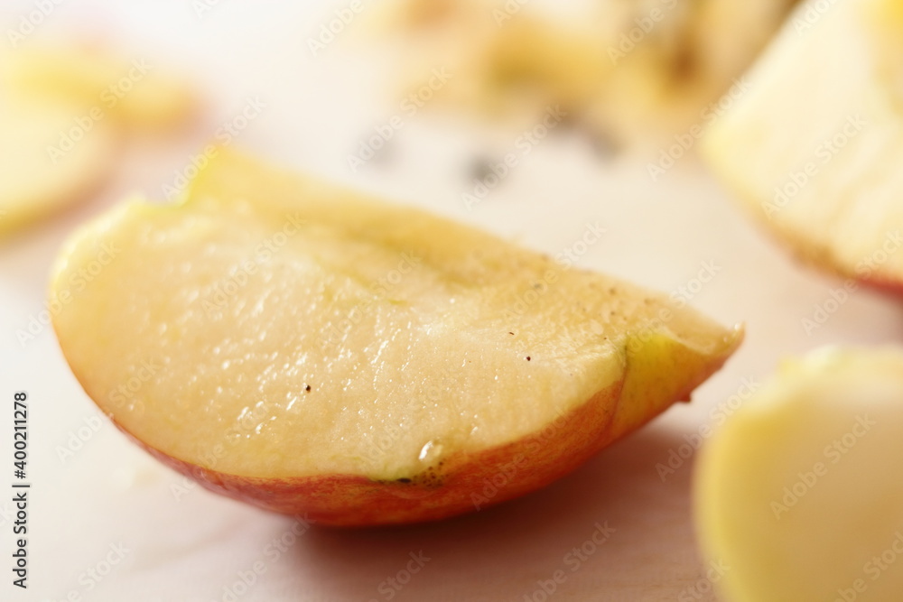 Apple quarter dipped in lemon juice. Making Apple Tarte Tatin with Cinnamon Series. Apple quarter dipped in lemon juice. Making Apple Tarte Tatin with Cinnamon Series.