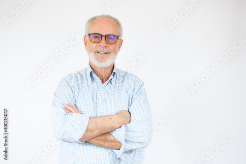Happy Mature Man With Arms Crossed over white background.