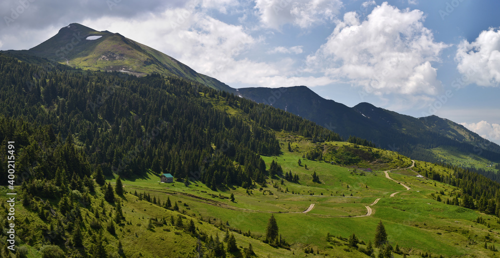 Panoramic landscape of Marmaros (Maramures) mountain range with Pip Ivan Marmarosky mountain and valley in bottom