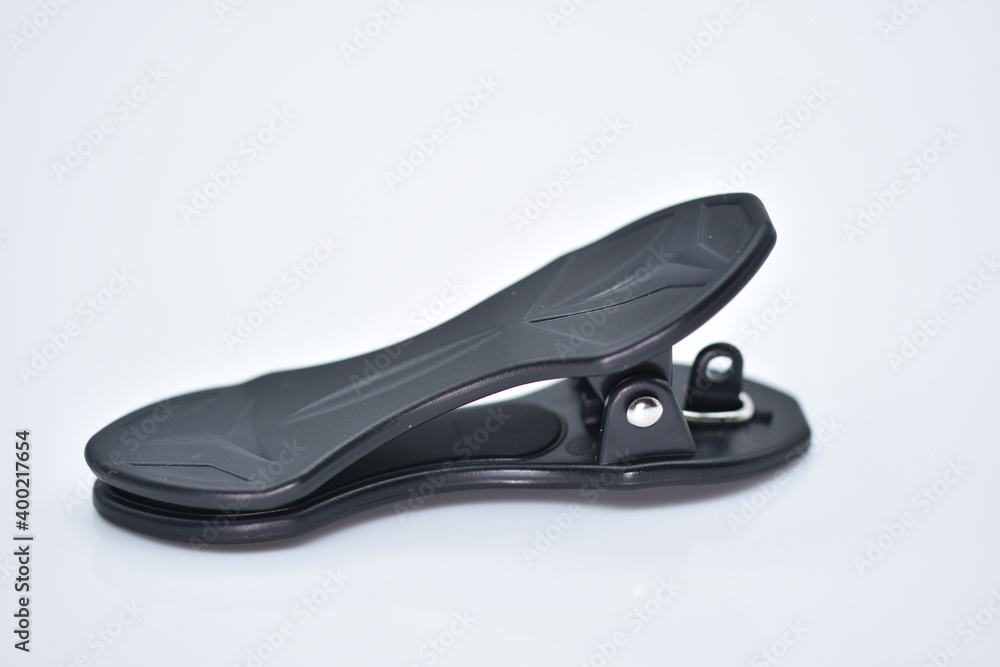 Obraz premium plastic clip holder for photo lenses on mobile phones
