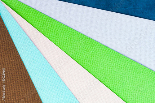 Abstract color papers geometry flat lay composition banner background with green, pink, blue color tones