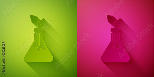 Paper cut Plant breeding icon isolated on green and pink background. Plants growing in the test tubes. Organic food ,agriculture and hydroponic. Paper art style. Vector.