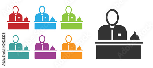 Black Receptionist standing at hotel reception desk icon isolated on white background. Set icons colorful. Vector.