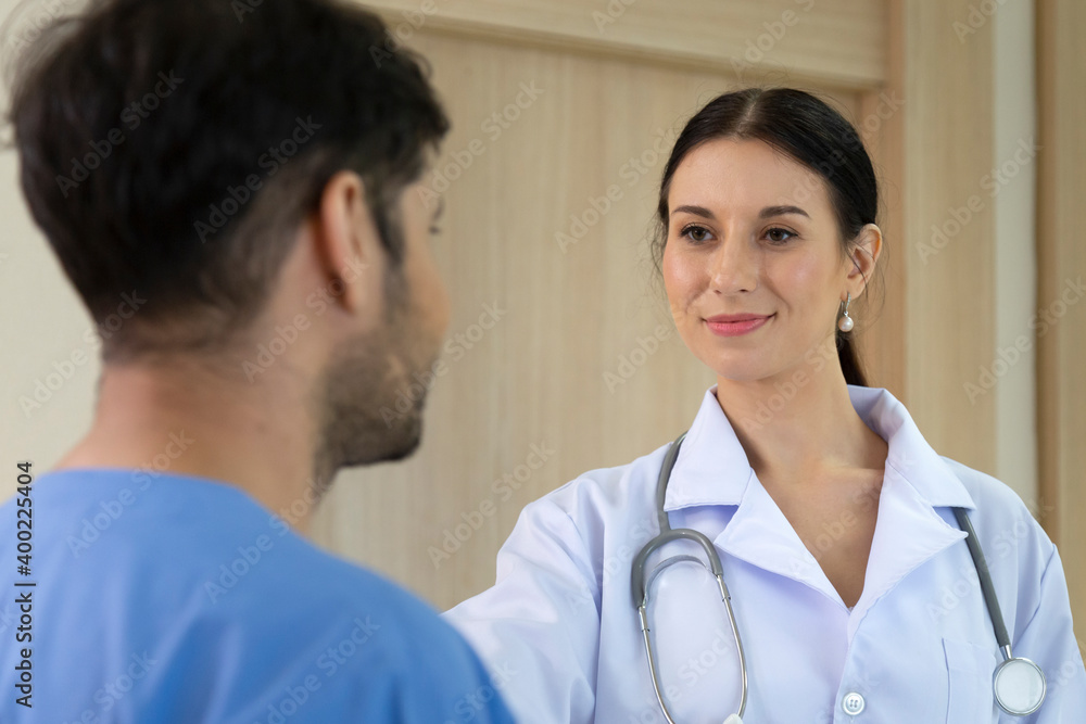 smiling female doctor helping support and reassuring patient after cancer surgical treatment recovery. medical and healthcare concept. smiling female doctor helping support and reassuring patient after cancer surgical treatment recovery. medical and healthcare concept.