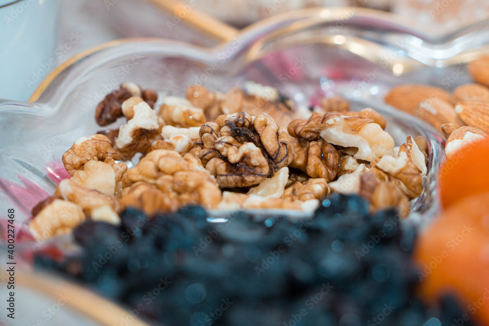 Obraz premium walnuts on a plate with different sweets