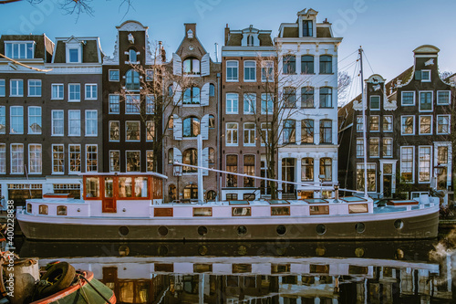 Photography Amsterdam canals in the evening light, Dutch canals in Amsterdam Holland Netherlands during winter time in the Netherlands