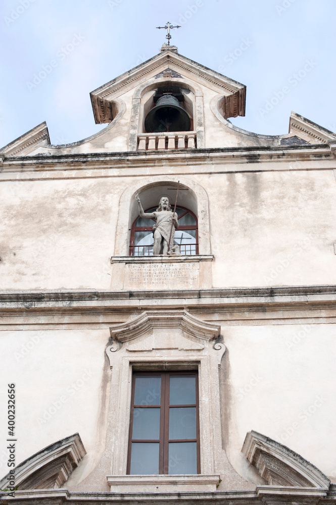 Italy has more than  100,000 churches scattered throughout the country. Part of the façade of the church of Saint Giovanni the Baptist, Aci Trezza, Sicily, Italy.