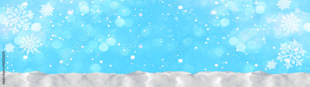 Snow snowflakes and ice crystals isolated on blue sky - winter background panorama banner long