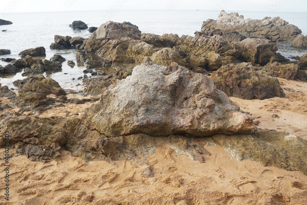 unique sandstone rocks shape by the sea. Reef stone on nature  background.