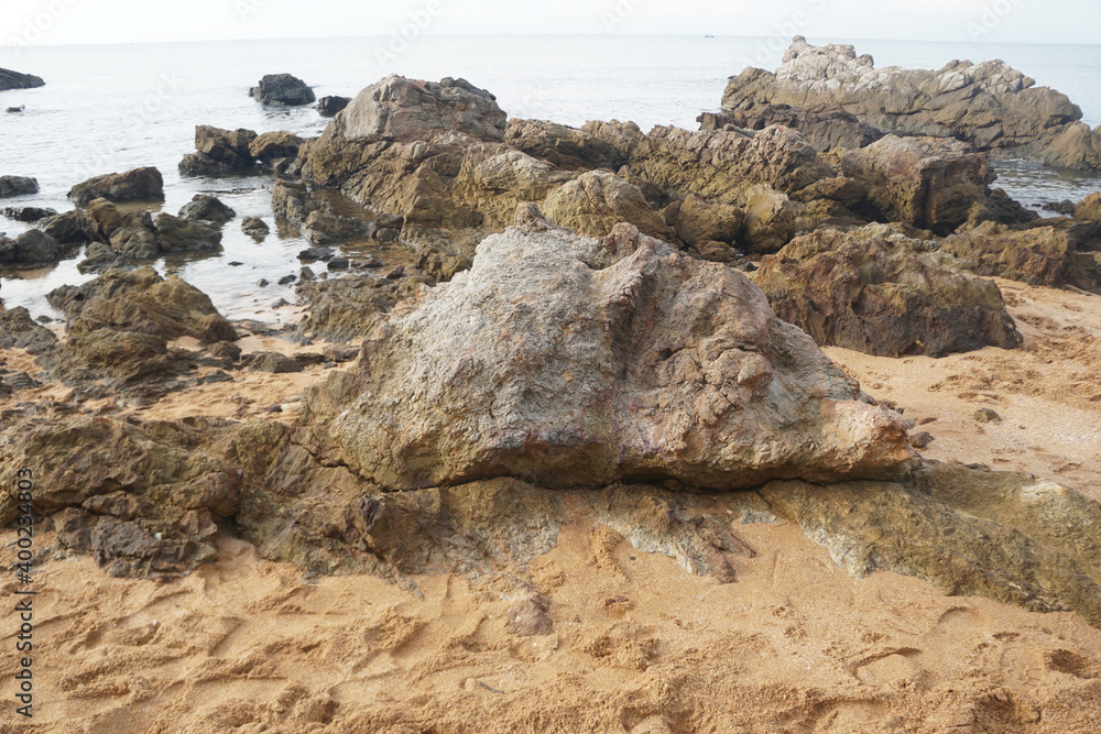unique sandstone rocks shape by the sea. Reef stone on nature background. unique sandstone rocks shape by the sea. Reef stone on nature background.