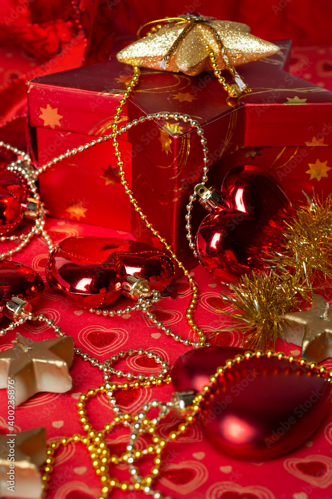 Christmas red decorations with gift box at red background. Christmas holiday concept.  close up