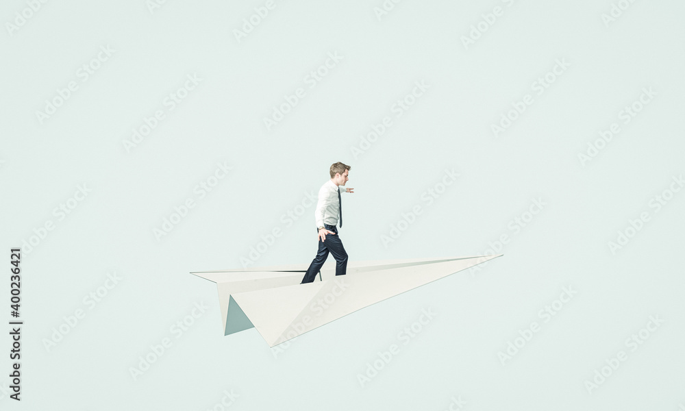 young business man flies on a paper plane.