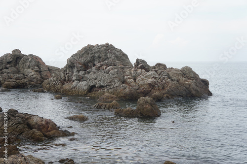 unusual sandstone emerging from the sea. reef rocks on natural background. © Montree