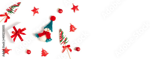 Christmas banner with snowman, gifts and Christmas decorations on a white background. New Year concept. Space for text. Top view, flat lay.