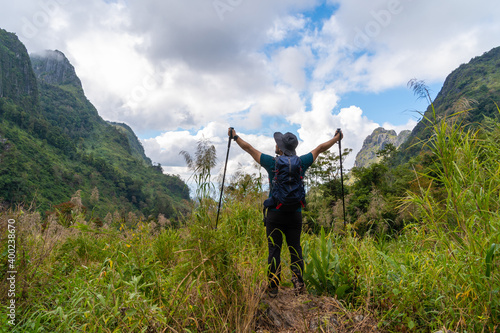 Rear view of man hiking mountain at Doi Luang Chiang Dao in Chiang Mai province, Thailand
