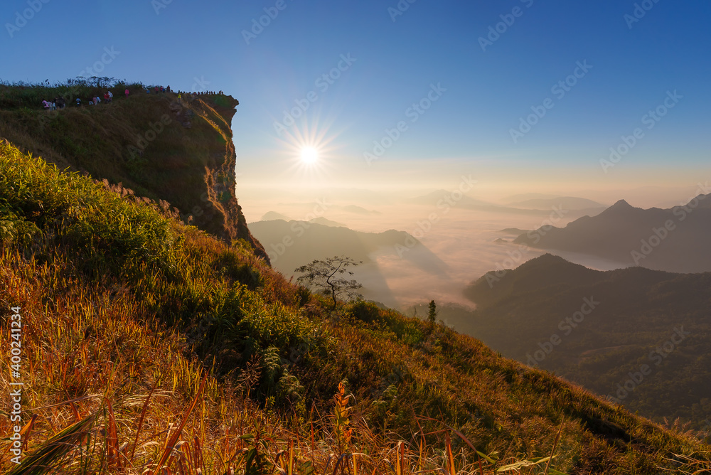 Beautiful misty mountain range in Laos from Phu Chi Fa mountain viewpoint in Chiang Rai province, Thailand