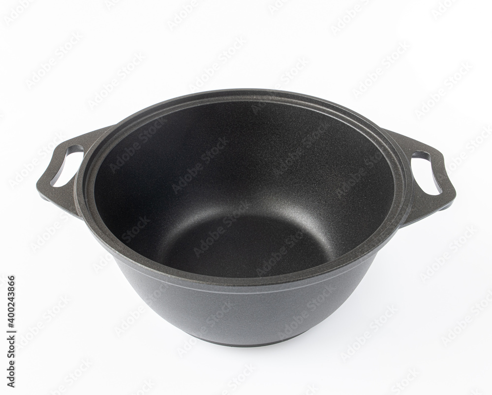 Black cast iron pan on the light background Black cast iron pan on the light background